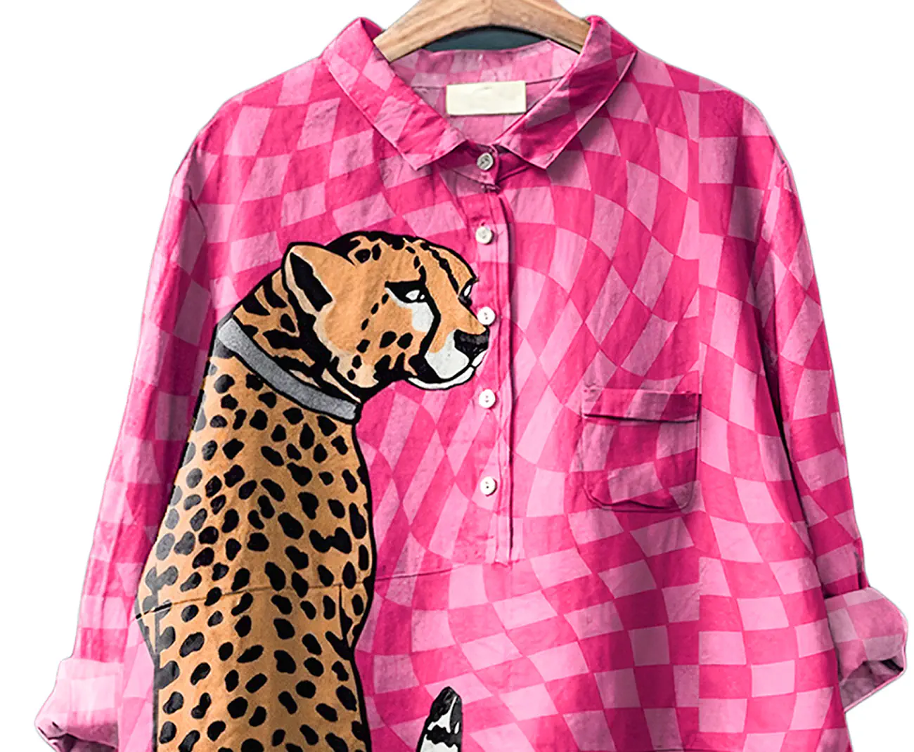 Pink checkered shirt with a leopard design on a hanger
